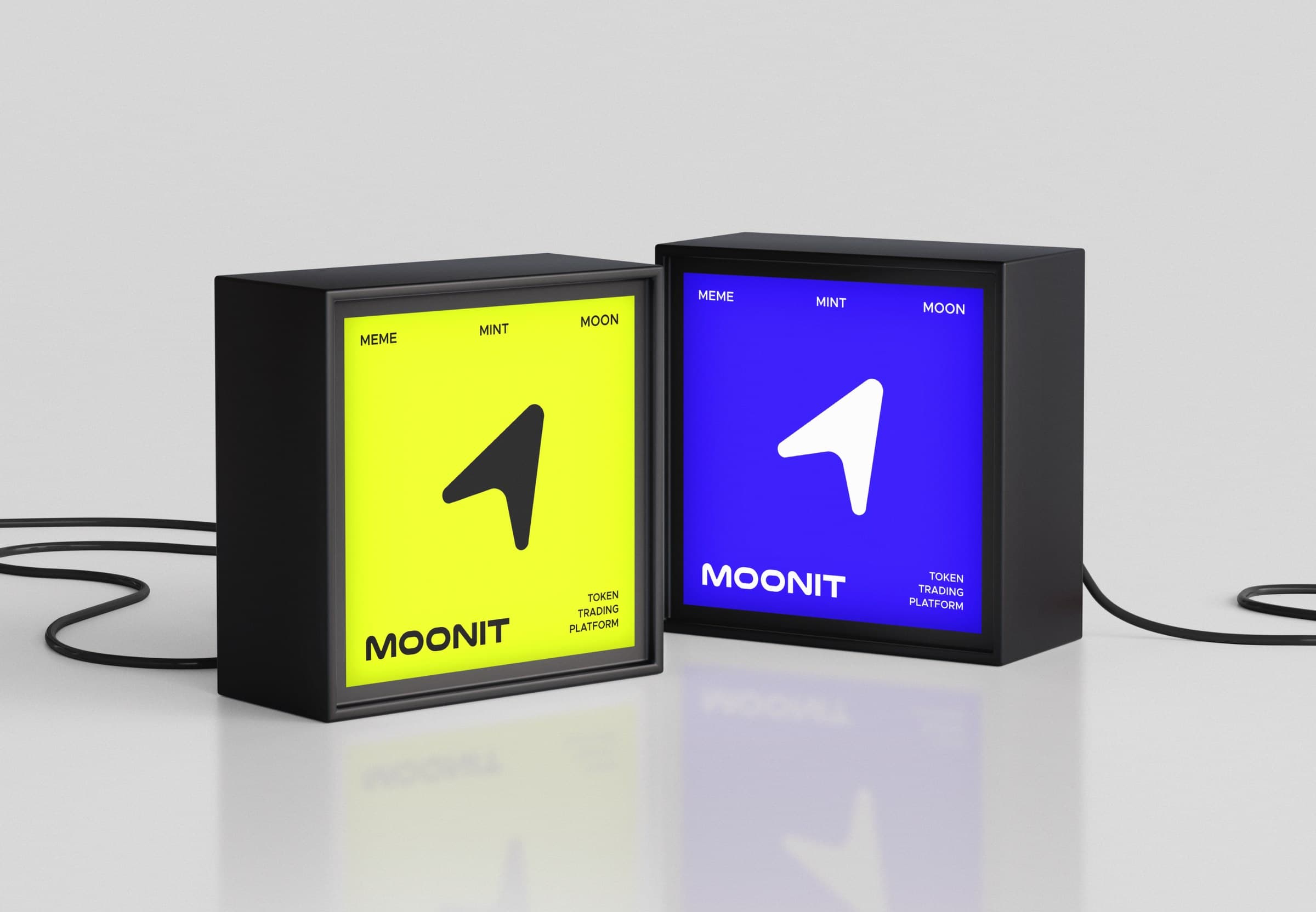 The Moonit mark on two illuminated light boxes, in acid yellow and blue